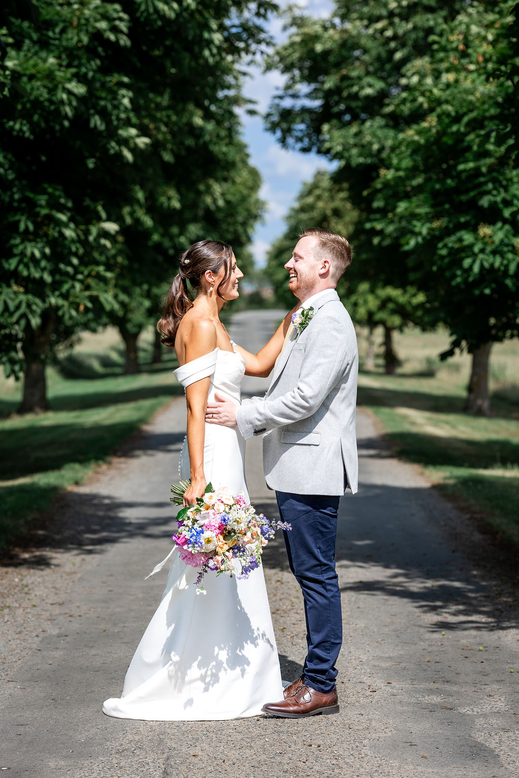 wedding-tree-lined-driveway-at-polehanger Wedding couple portrait shot on the tree-lined drive at The Gardens at Polehanger
