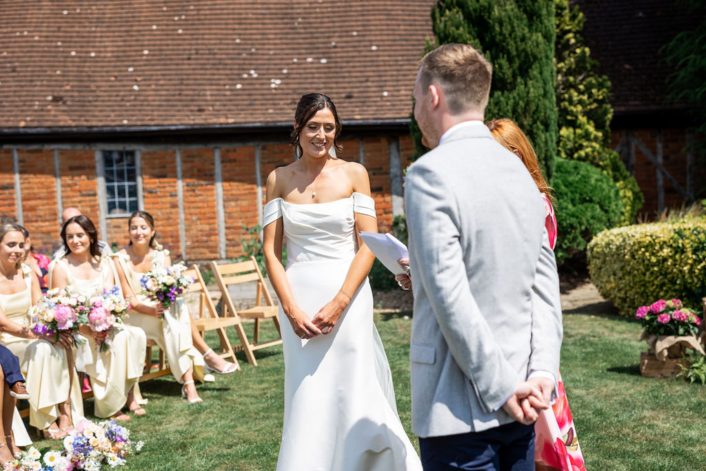 wedding-vows-gardens-at-polehanger Couple exchanging vows in the gardens at Polehanger